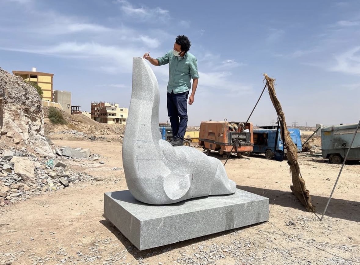 Mohamed Sabry Bastawy with large-scale blue painting, 2023