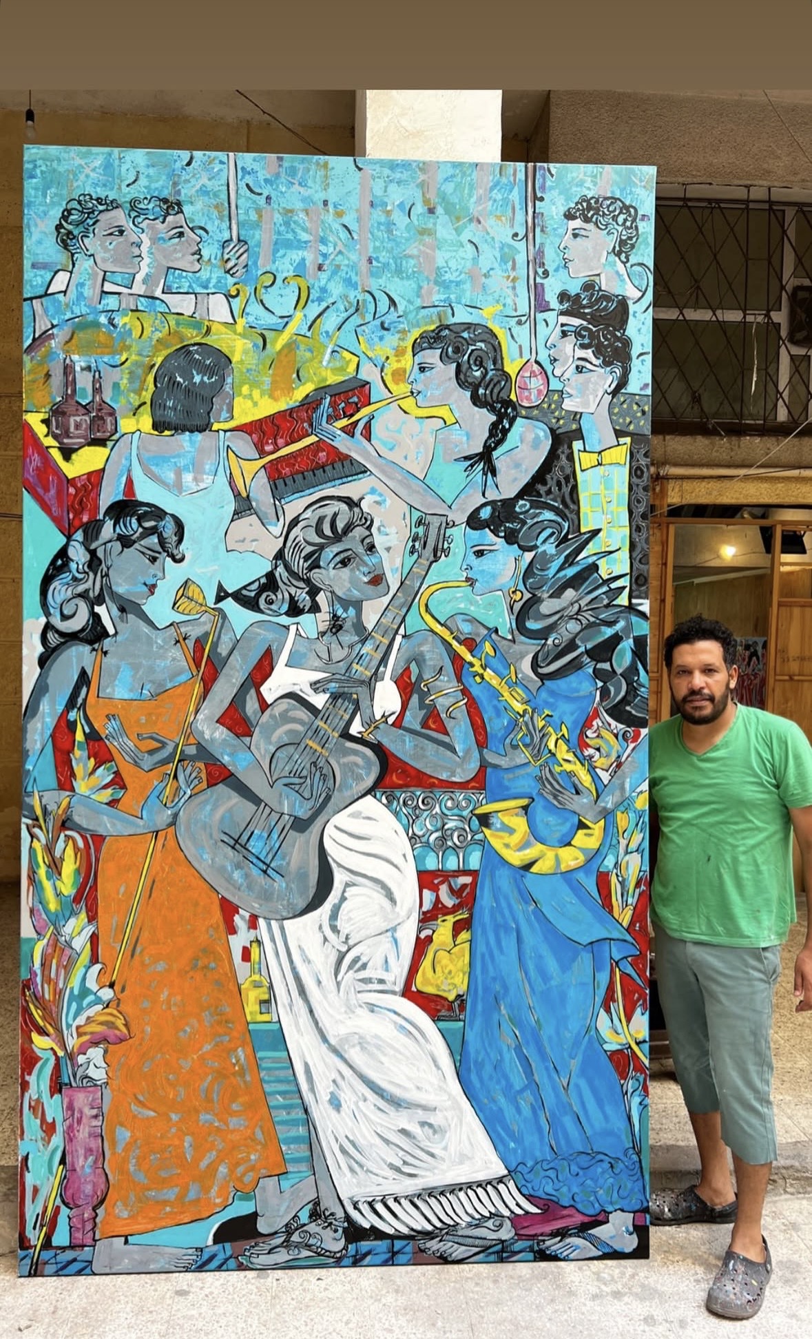 Mohamed Sabry Bastawy with large vertical painting, 2022