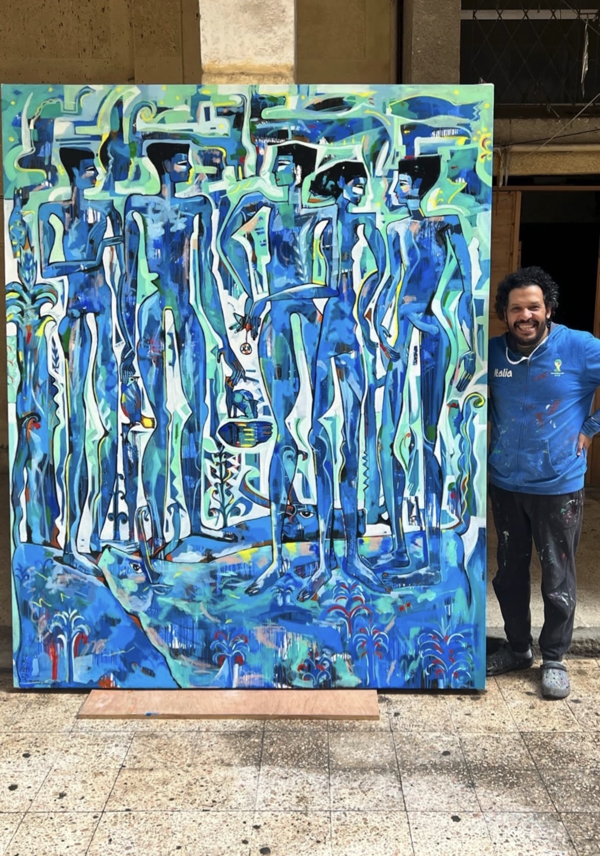 Mohamed Sabry Bastawy with Tree of Love painting, 2022